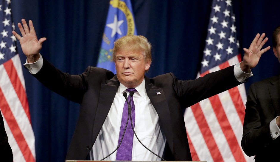 Republican presidential candidate Donald Trump speaks during a caucus night rally Tuesday, Feb. 23, 2016, in Las Vegas. (AP Photo/Jae C. Hong)